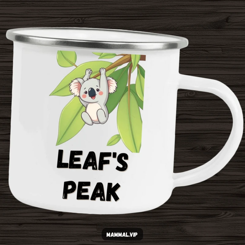 Funny camping mug with a cheerful koala hanging upside down from a giant eucalyptus leaf, perfect for outdoor humor.