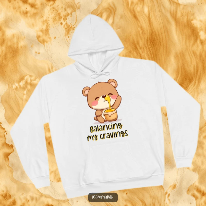 Funny Hoodie showing a giggling bear character with a honey pot balanced on its nose, radiating happiness and a love for treats.