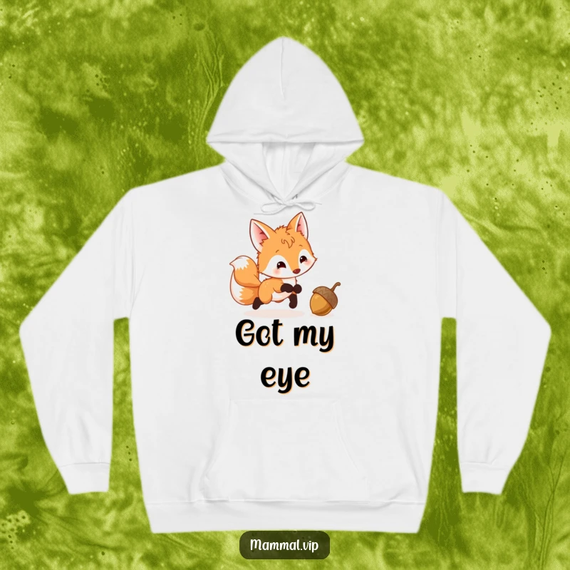 Funny Fox Cub Hoodie depicting a playful cub with a wagging tail, its eyes fixed on a bouncing acorn, embodying pure joy.