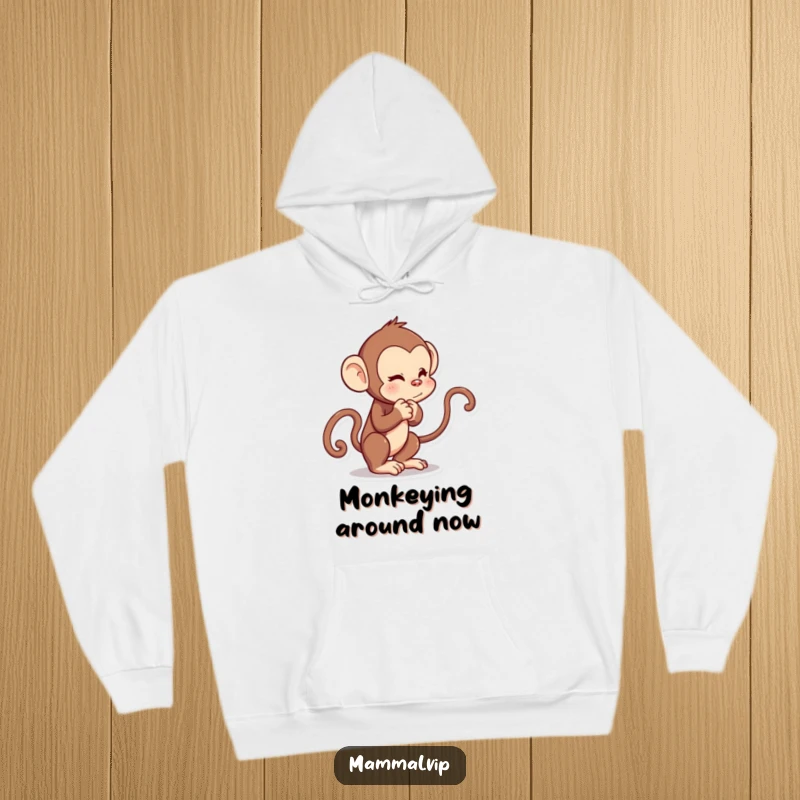 Funny hoodie featuring a curious cartoon monkey character engaged in a playful tug-of-war with its own tail.