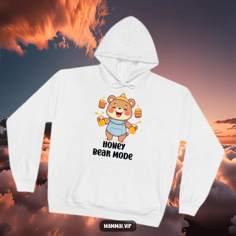 Funny joyful bear character juggling honey pots, featured on a warm hoodie, embodying a humorous animal and nature theme.