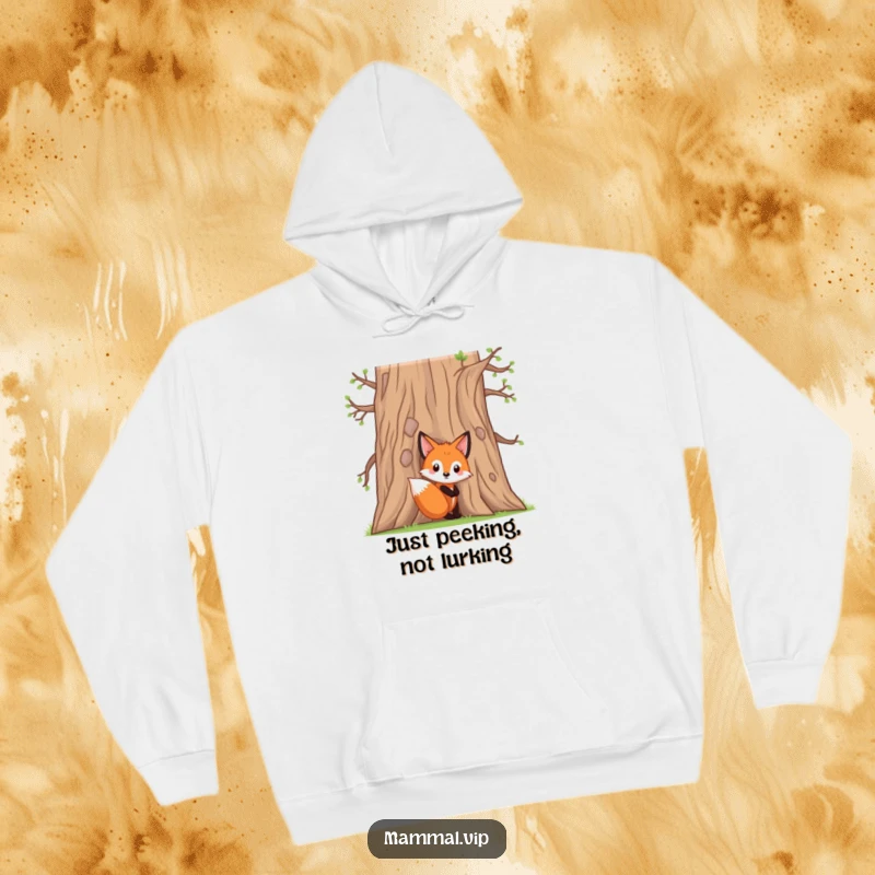 Funny fox kit hoodie with a curious character peeking from behind a large oak tree, perfect for staying warm and looking stylish.