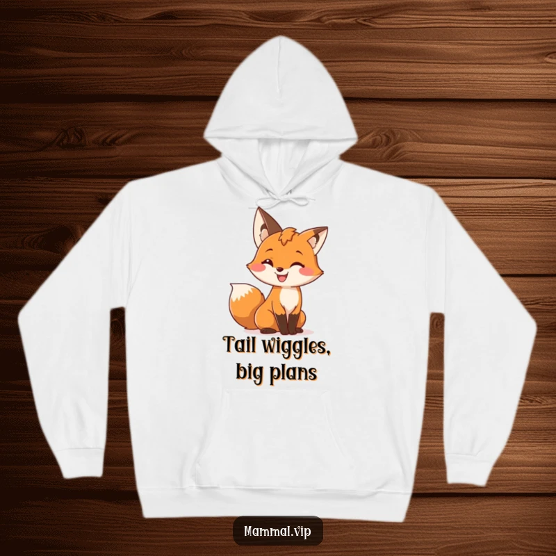 Funny hoodie depicting a cute fox character with a wide grin, playfully wiggling its bushy tail, perfect for cozy and charming moments.