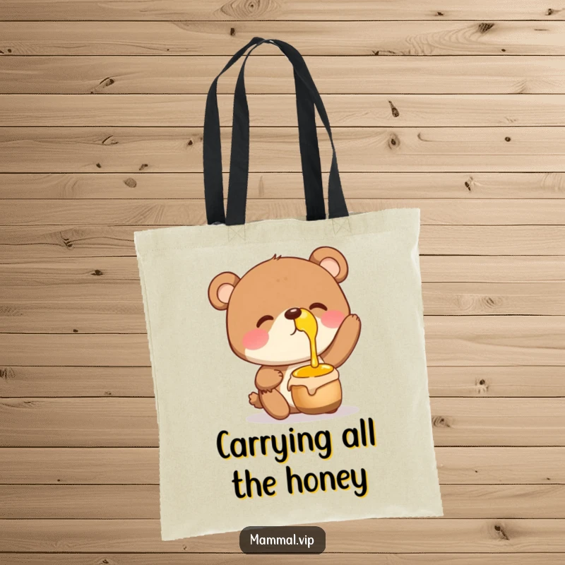 Funny Tote Bag showcasing a giggling bear character balancing a honey pot on its nose, perfect for carrying goodies.