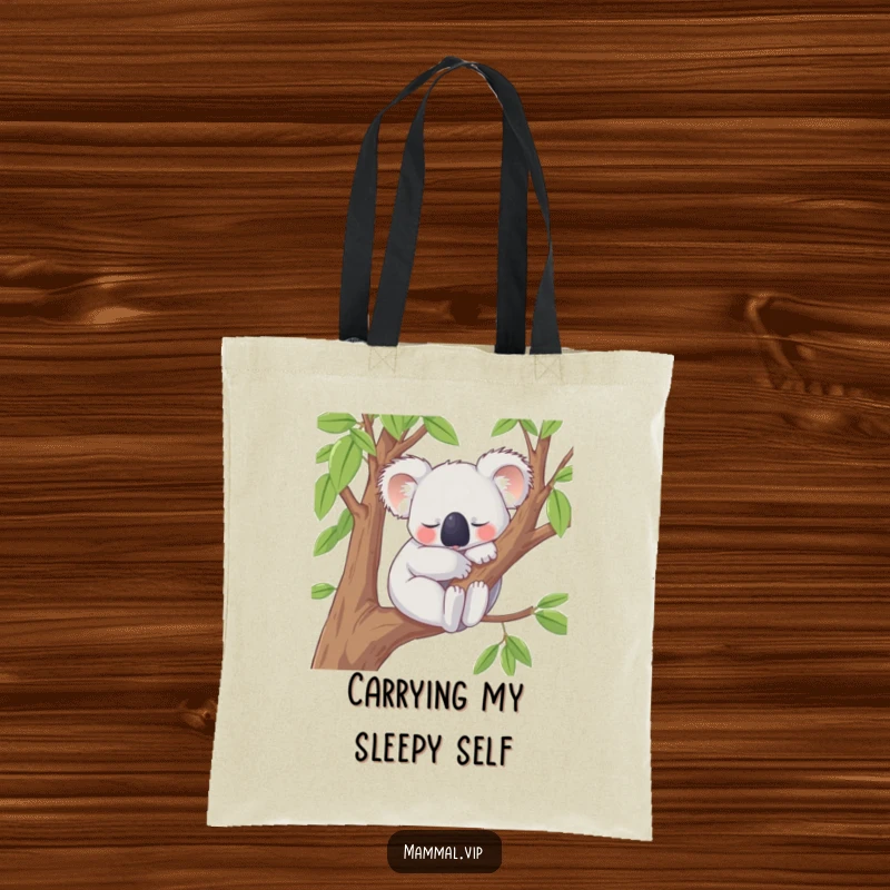 Funny Tote Bag with a content koala character peacefully snoozing on a tree branch, a practical and humorous accessory for carrying your items with a relaxed attitude.